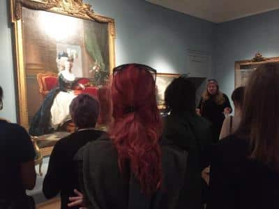 a group of people in a room a group of people in a room