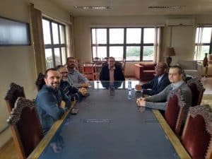 a group of people sitting at a table in a room