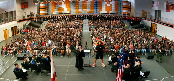 a group of people standing in front of a crowd a group of people standing in front of a crowd