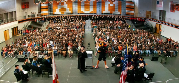 a group of people standing in front of a crowd