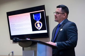 a man standing in front of a computer