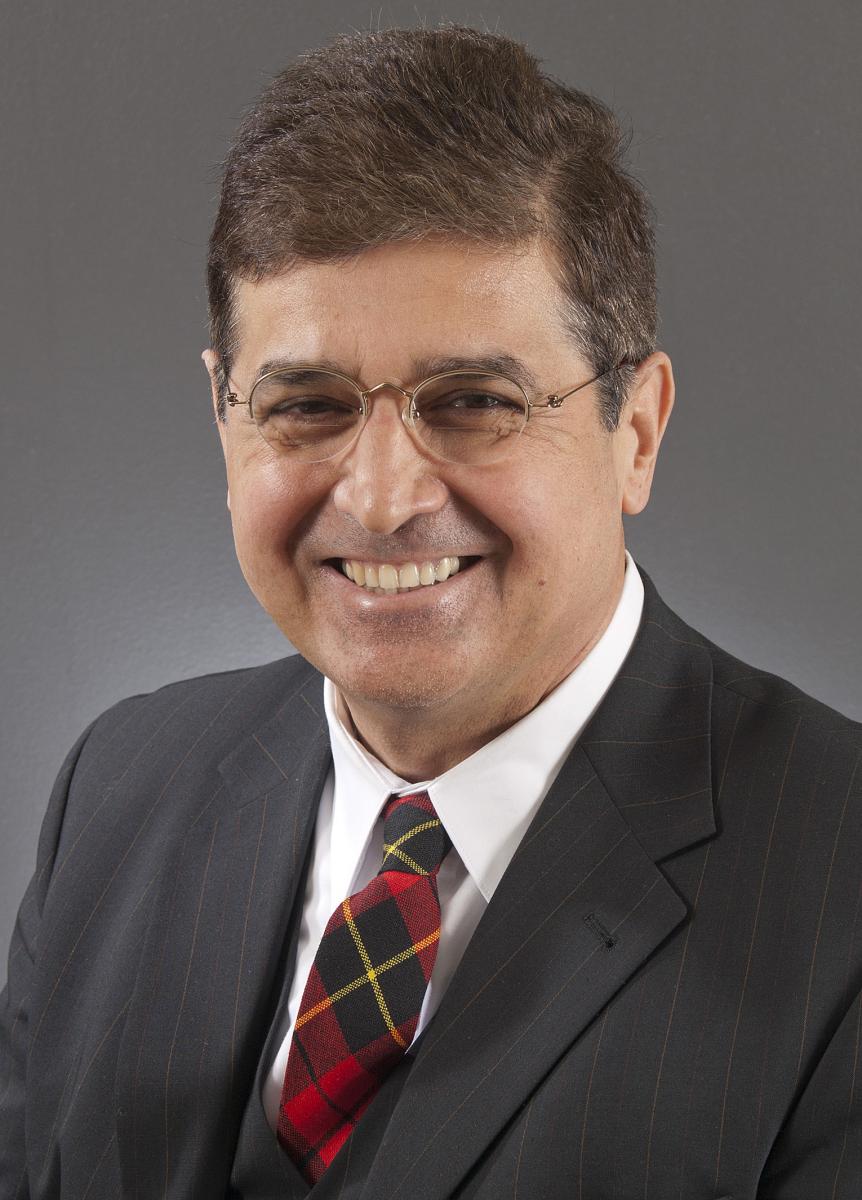 a man wearing a suit and tie a man wearing a suit and tie