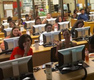 a group of people sitting at a desk