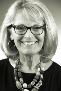 a person wearing glasses and smiling at the camera a person wearing glasses and smiling at the camera