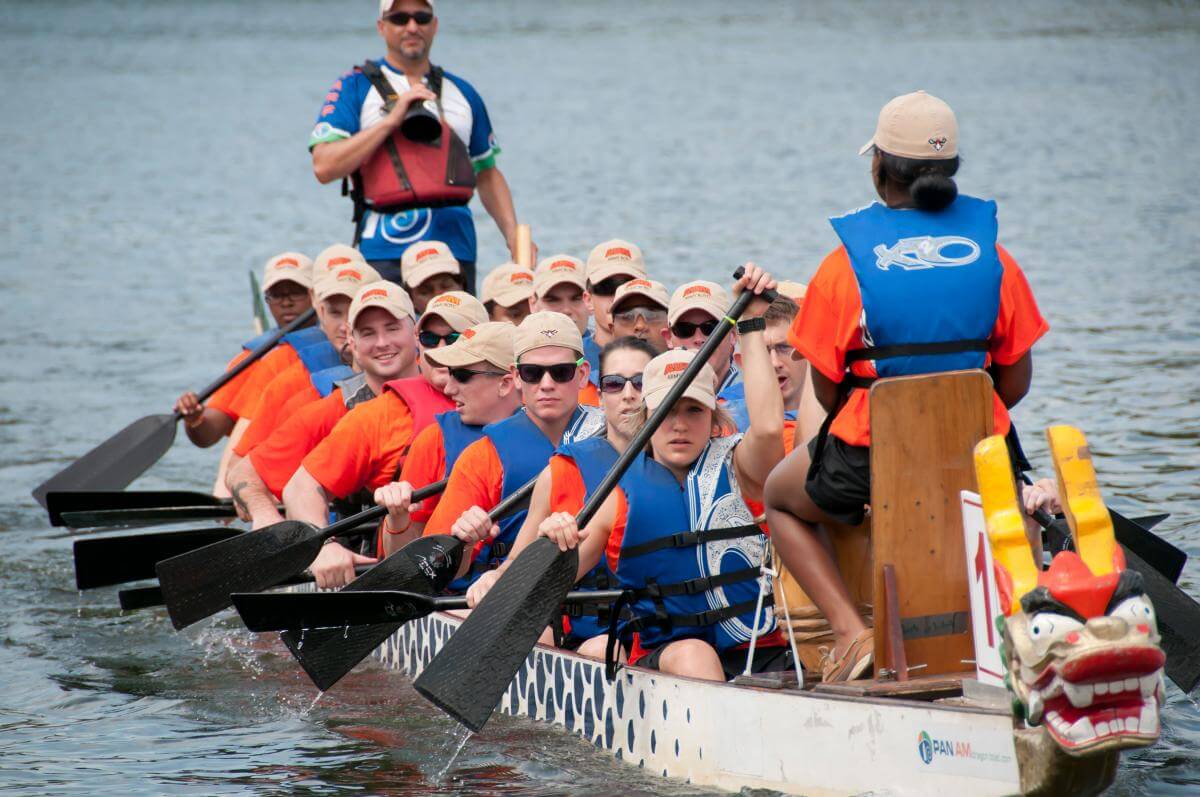 a group of people riding on the back of a boat