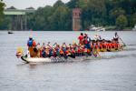 a group of people in a boat on a body of water