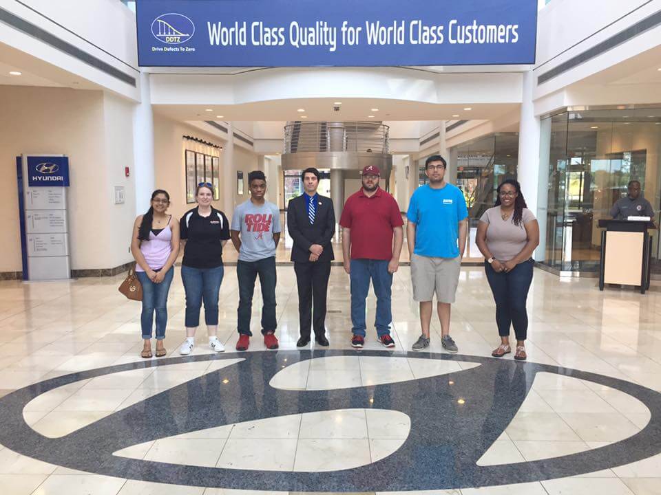 a group of people standing in front of a building