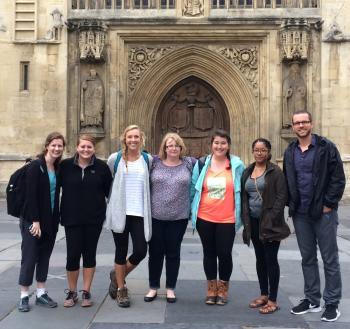 a group of people standing in front of a building