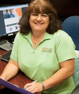 a person sitting in front of a computer