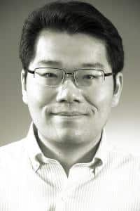 a man wearing glasses posing for the camera a man wearing glasses posing for the camera