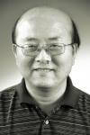 a man wearing glasses posing for the camera a man wearing glasses posing for the camera