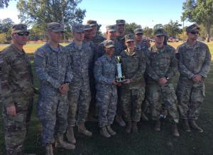 a group of people standing in front of a military uniform