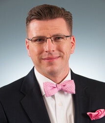 a man wearing a suit and tie a man wearing a suit and tie
