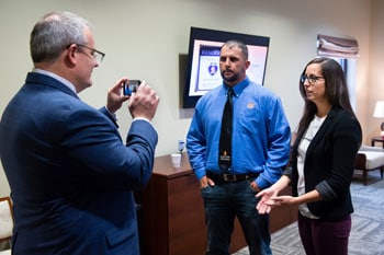 a group of people standing in a room