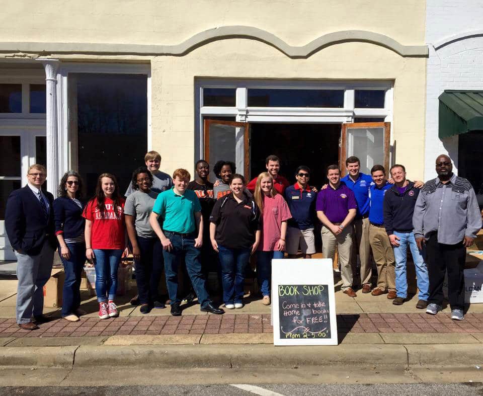 a group of people standing in front of a building