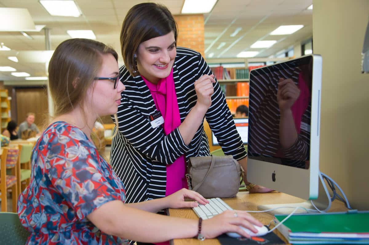 a woman using a computer a woman using a computer