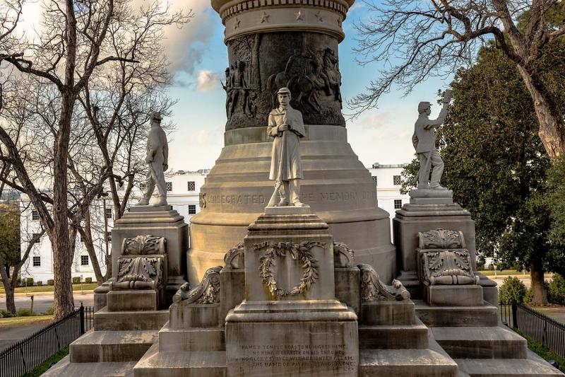 a statue in front of a building