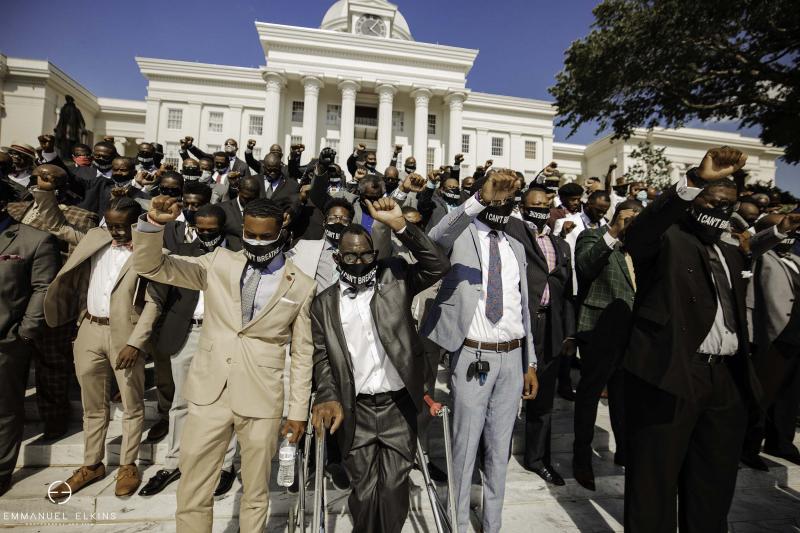 a group of people in uniform standing in front of a crowd a group of people in uniform standing in front of a crowd