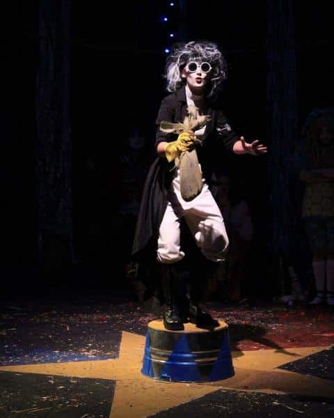 a person standing in a dark room a person standing in a dark room