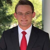 a man wearing a suit and tie a man wearing a suit and tie