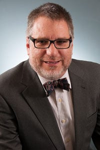 a man wearing a suit and tie a man wearing a suit and tie