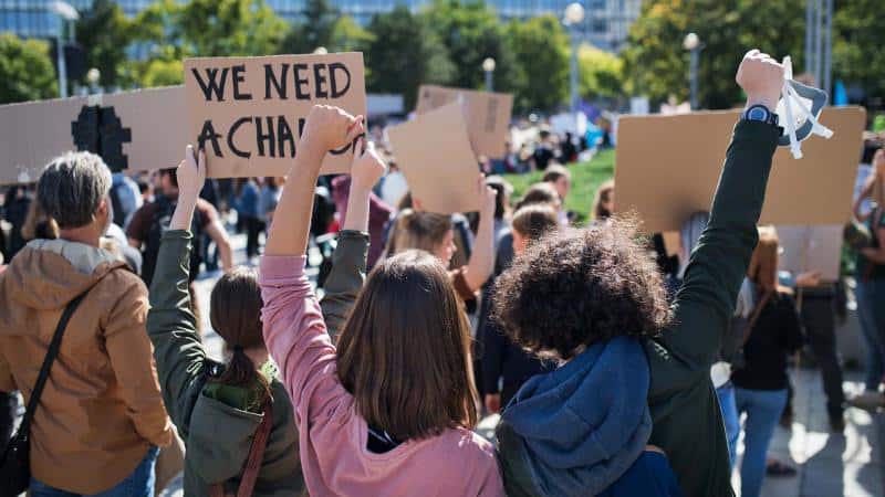 a group of people holding a sign