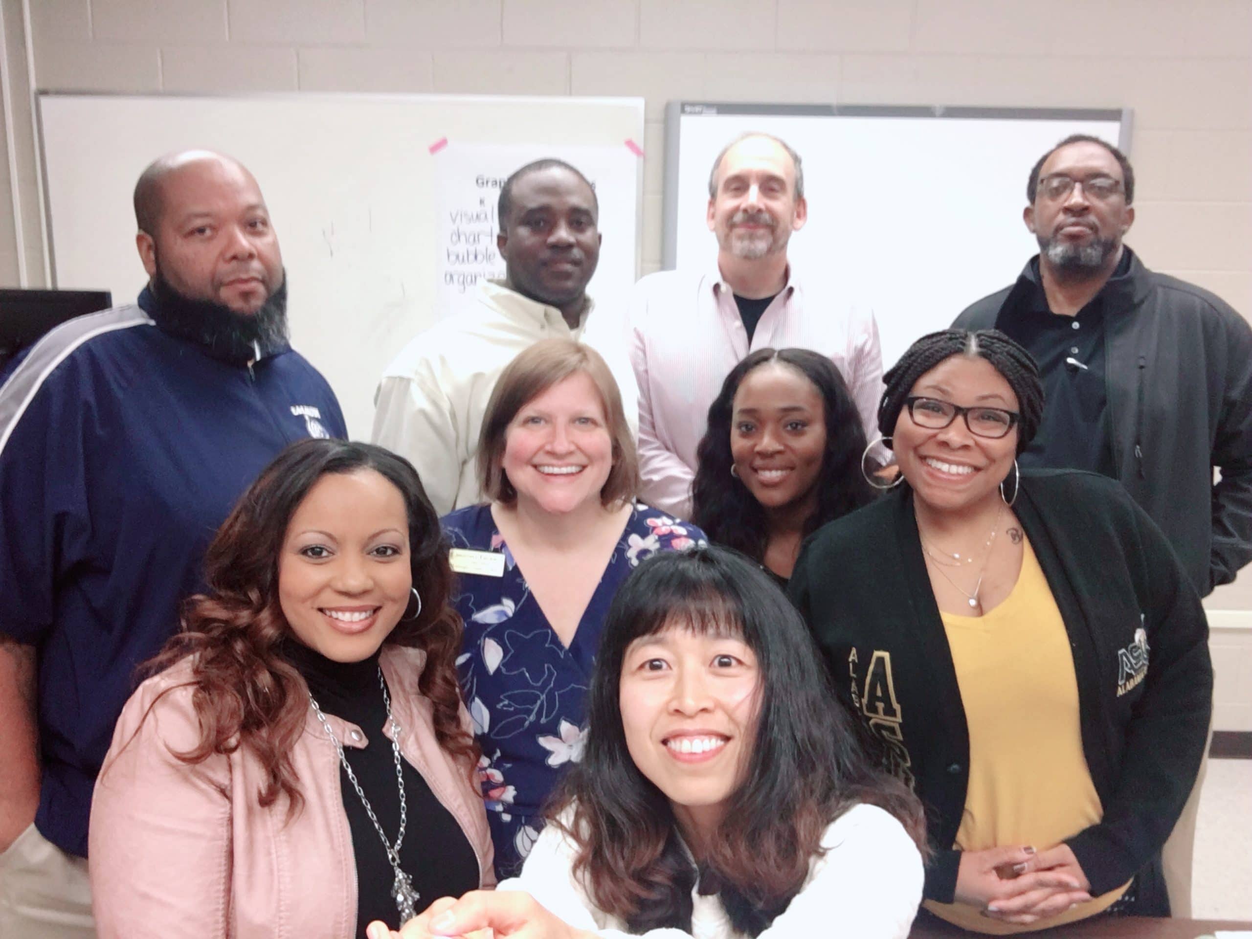 Dr. J. Mark. Coleman et al. posing for a photo