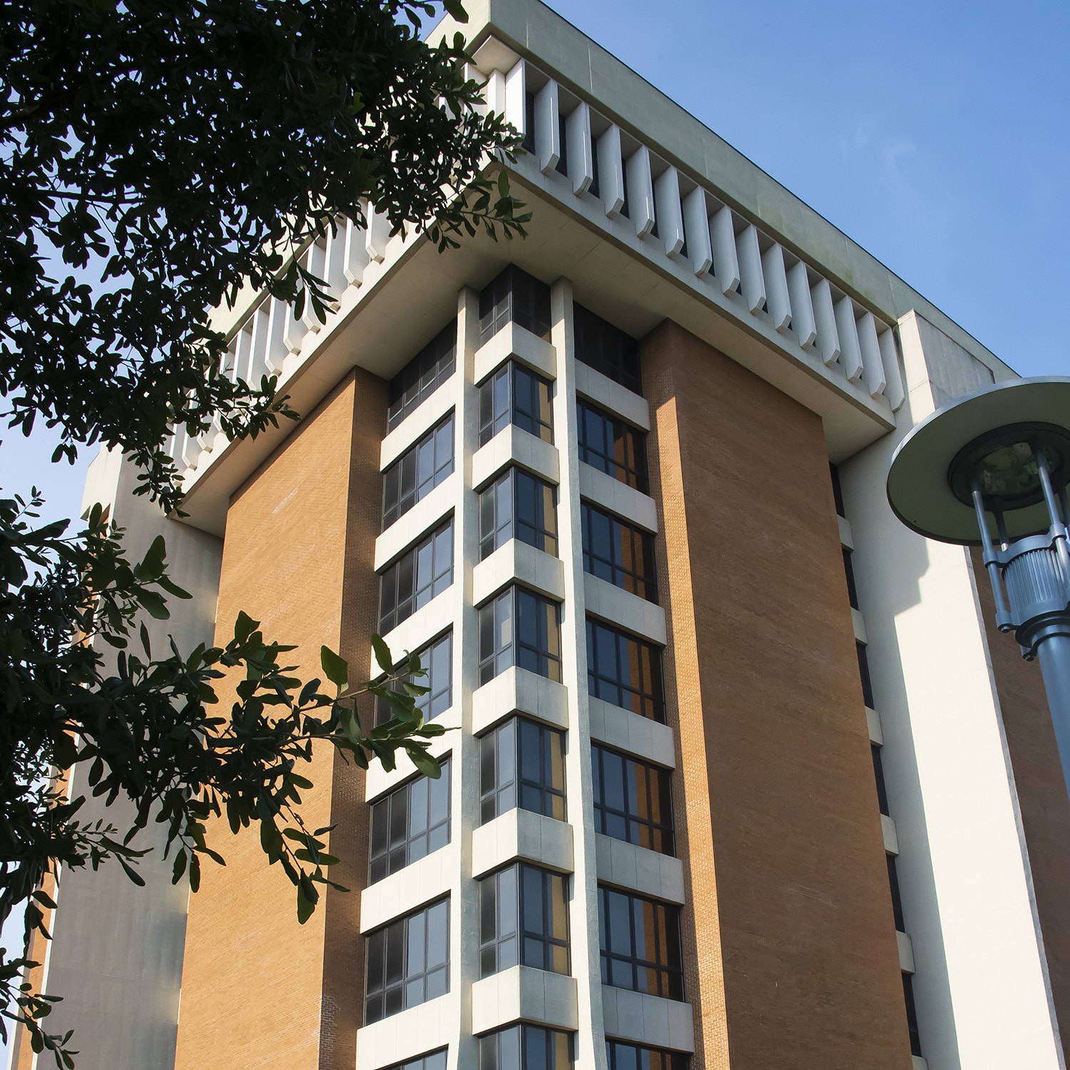 a large tall tower with a clock on the side of a building