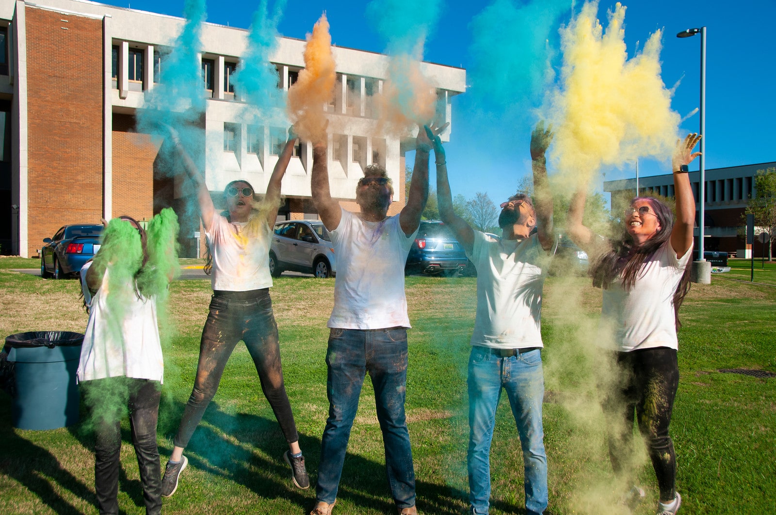 a group of people standing around a fire