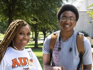 Two smiling AUM students