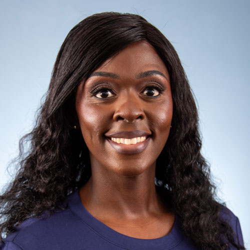 Auburn University at Montgomery headshot of a Kalia Cook smiling on a light blue background