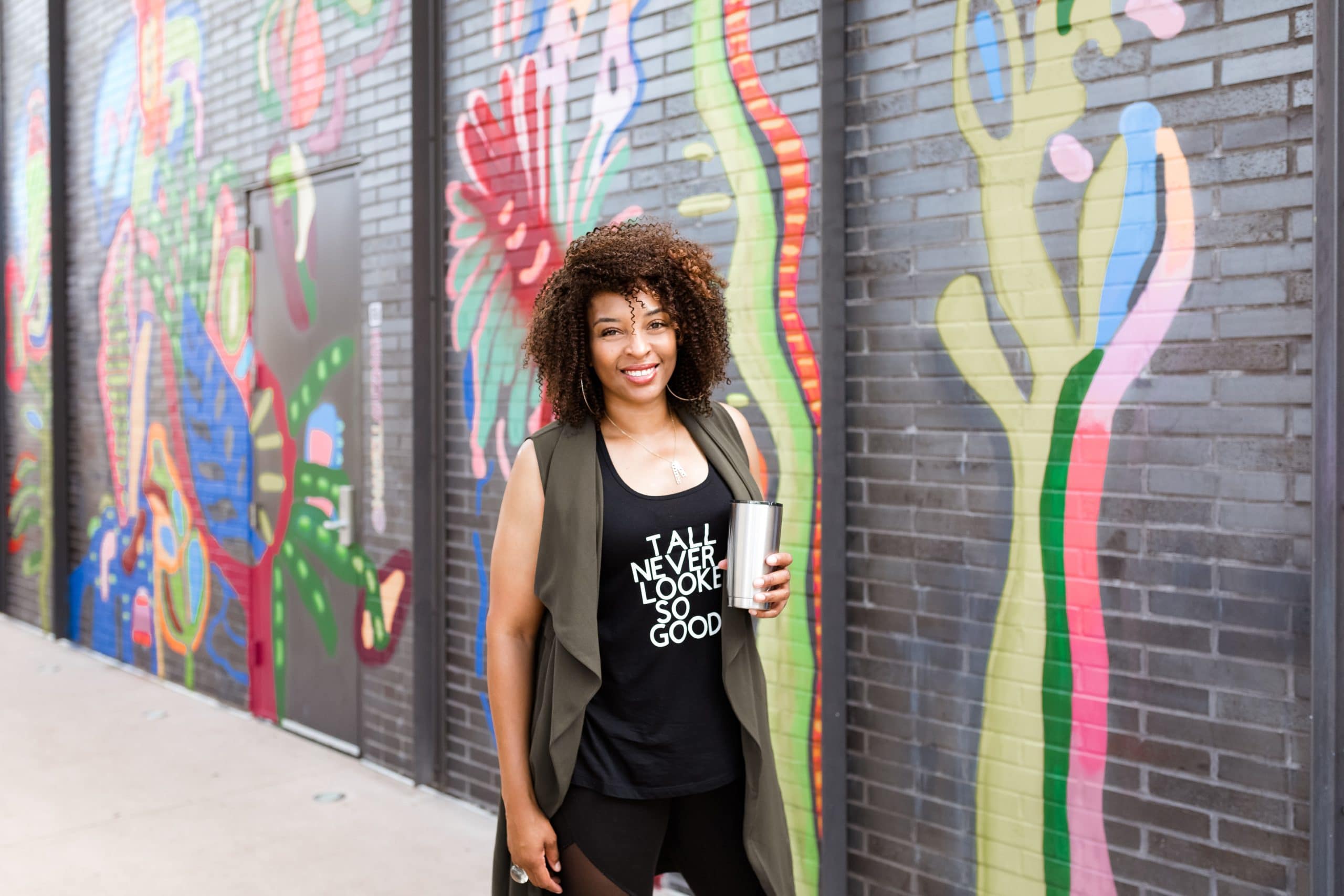 a woman standing in front of a building