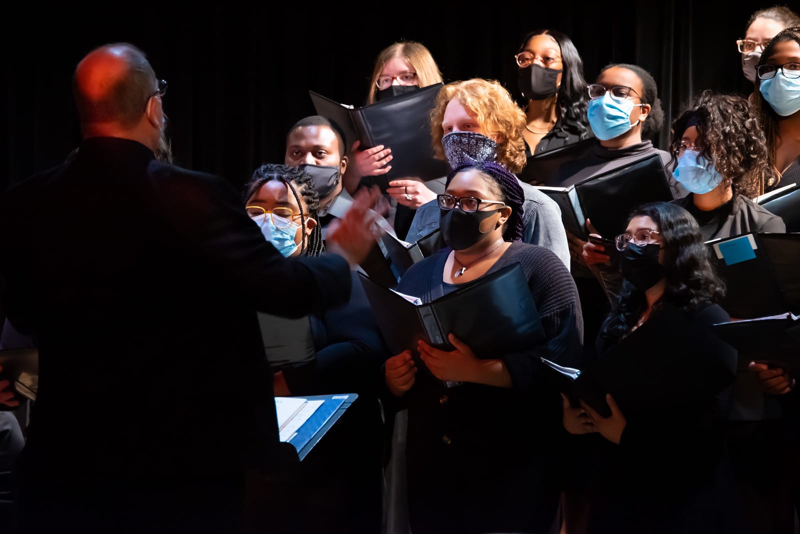 a group of people standing in front of a crowd