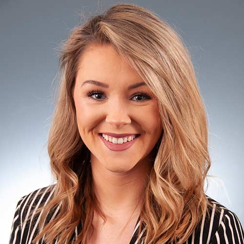 a woman smiling for the camera