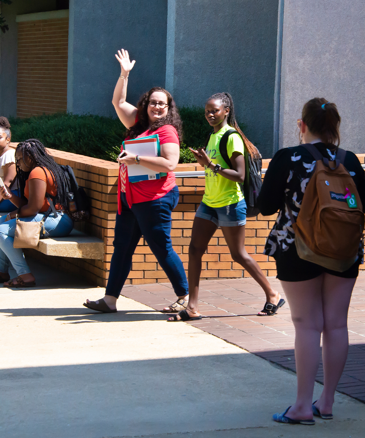 a group of people on a sidewalk