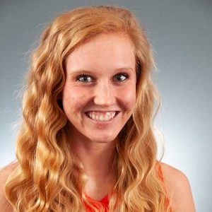 A Person Smiling For The Camera