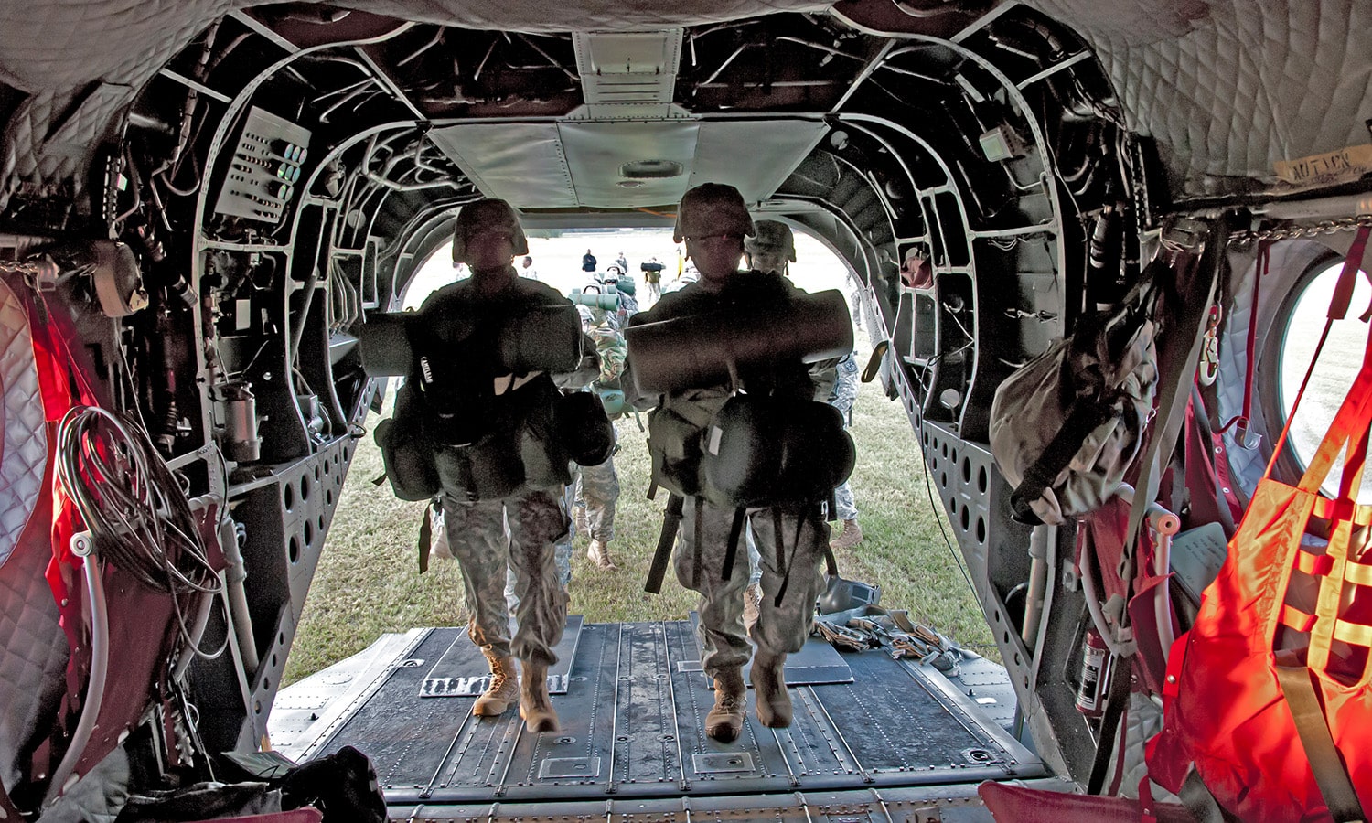soldiers load onto a helicopter