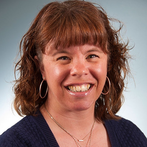 a woman smiling for the camera