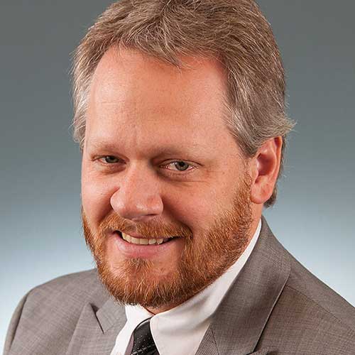 a man wearing a suit and tie