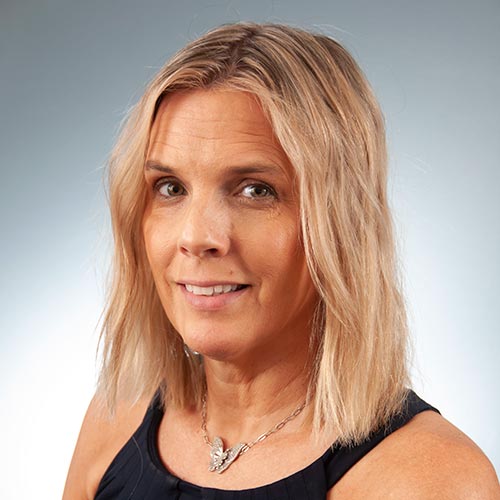 a woman smiling for the camera