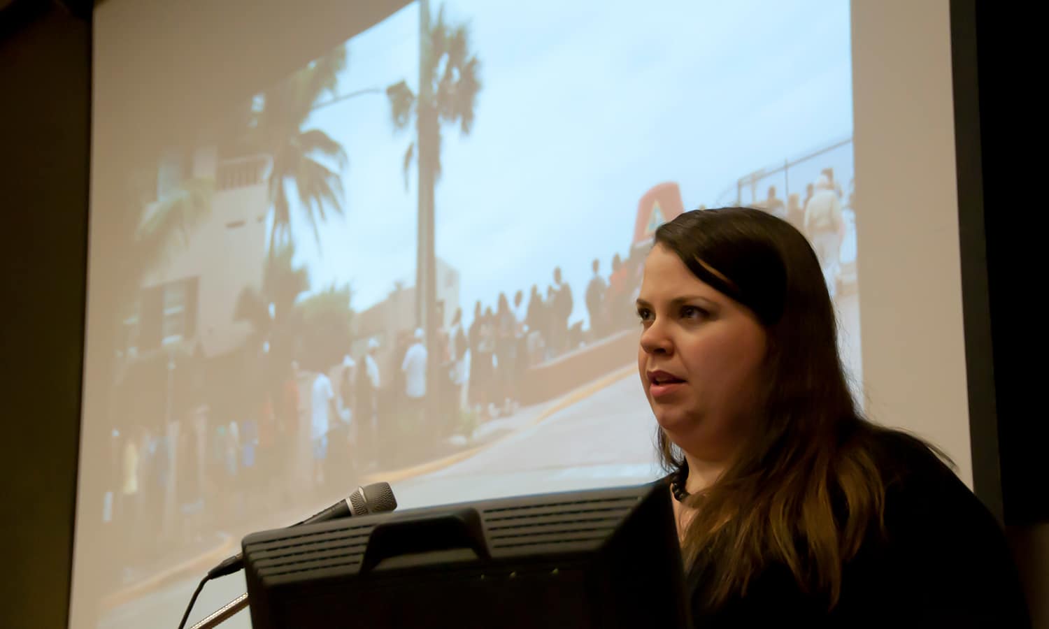 a person standing in front of a laptop