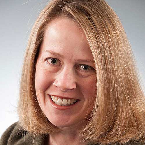 a close up of a woman smiling for the camera