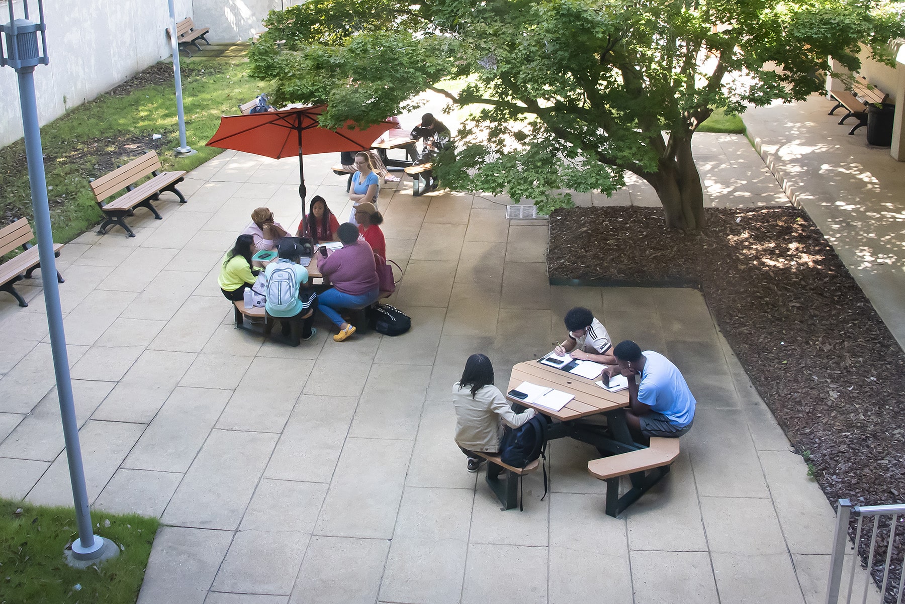 a group of people sitting on a bench