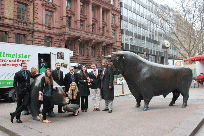 a group of people standing in front of a building