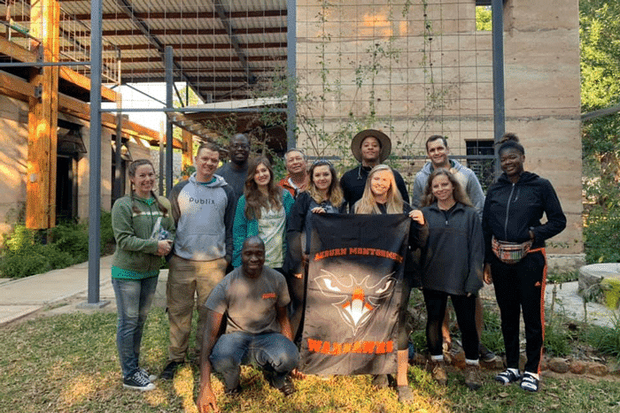 a group of people standing in front of a building