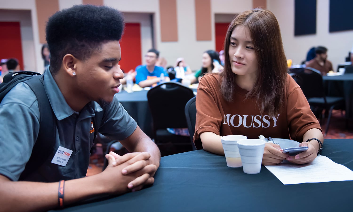 a group of people sitting at a table