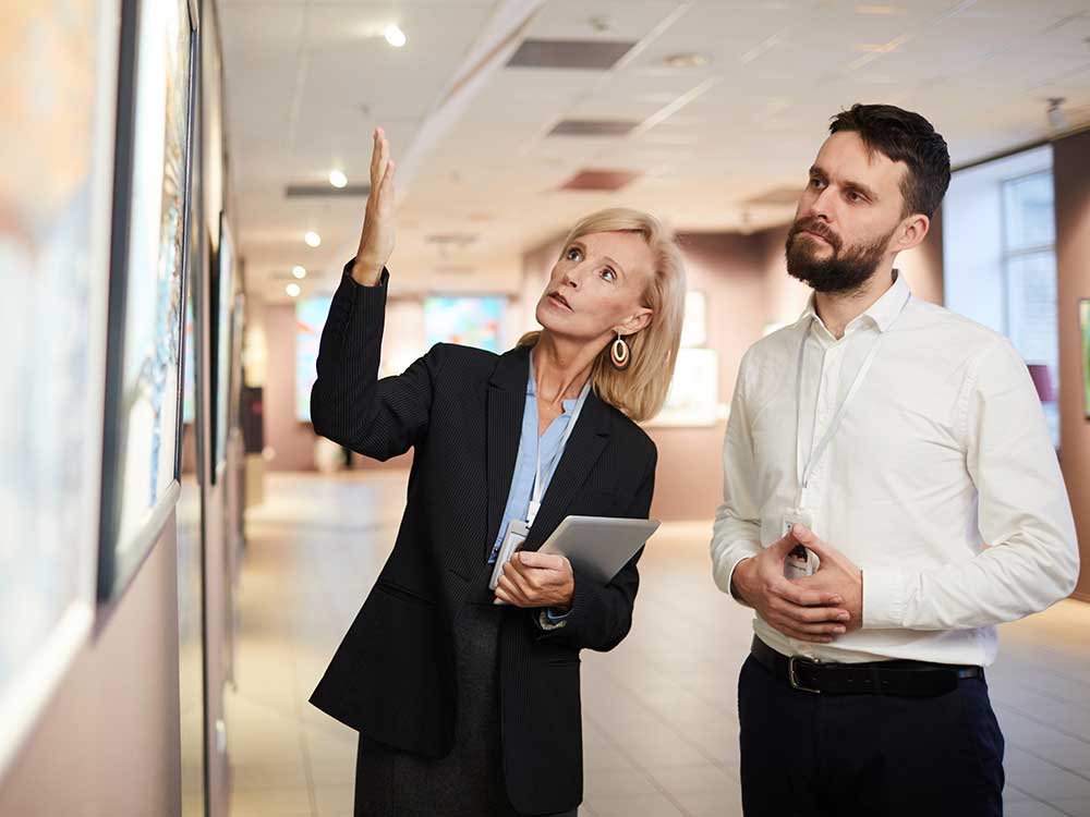 a man and a woman standing in a room