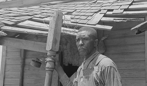 a man standing in front of a building