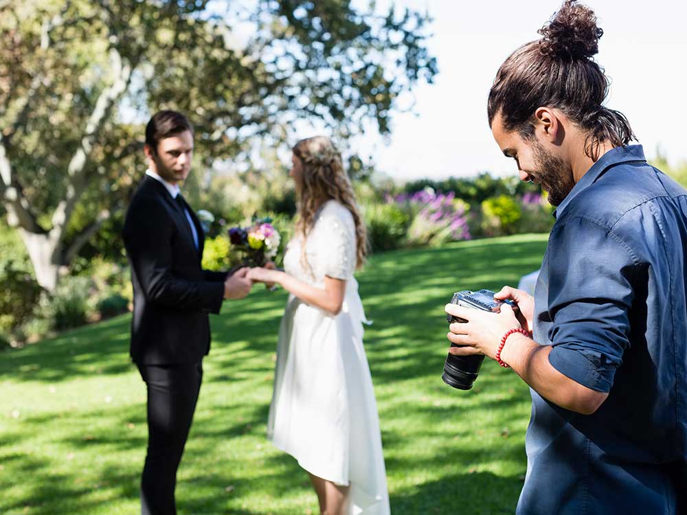 a couple of people that are standing in the grass