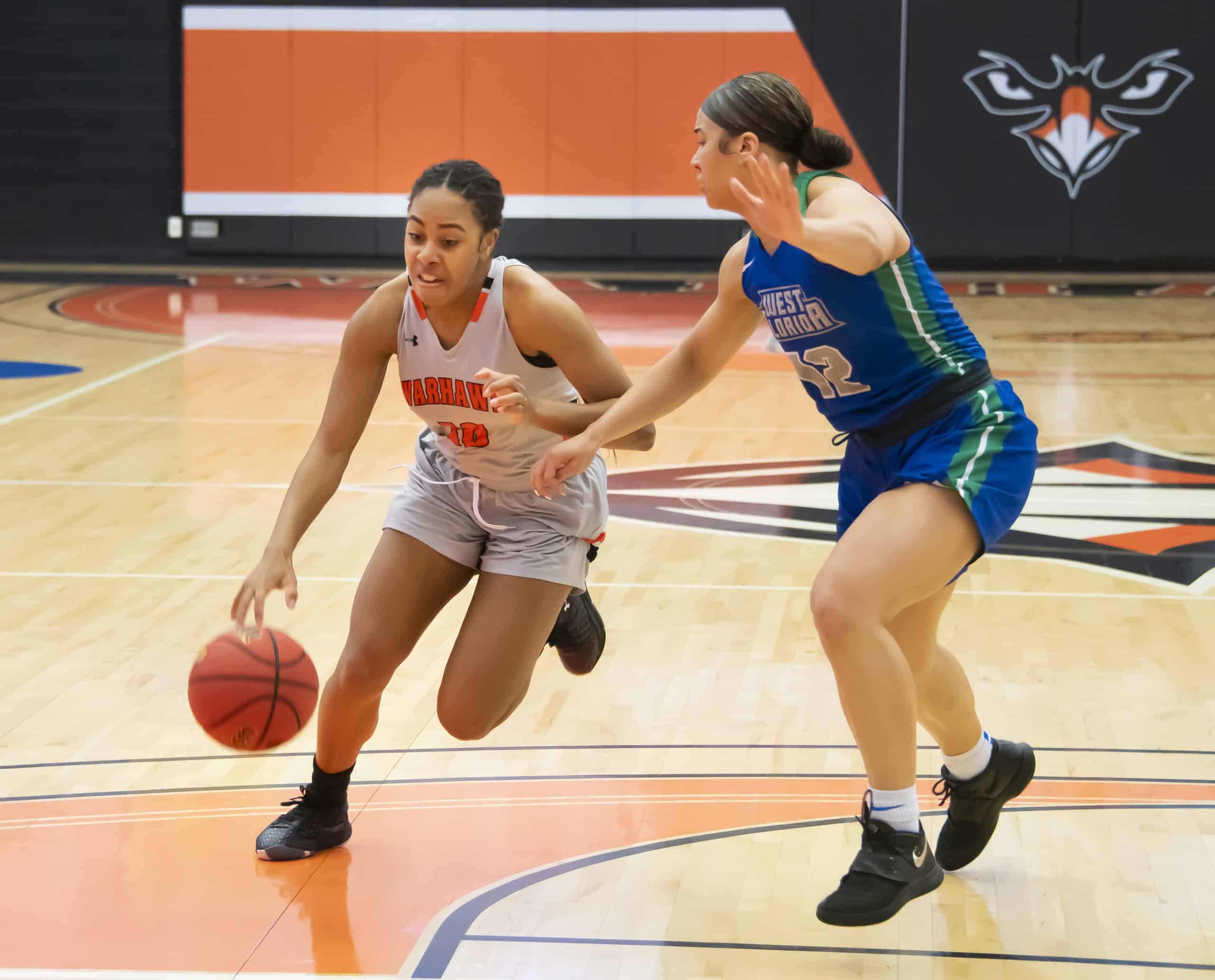 a woman playing a game on the court